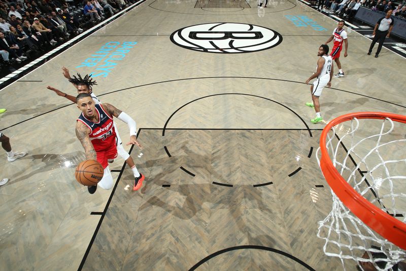 BROOKLYN, NY - OCTOBER 14: Kyle Kuzma #33 of the Washington Wizards drives to the basket during the game against the Brooklyn Nets during a NBA preseason game on October 14, 2024 at Barclays Center in Brooklyn, New York. NOTE TO USER: User expressly acknowledges and agrees that, by downloading and or using this Photograph, user is consenting to the terms and conditions of the Getty Images License Agreement. Mandatory Copyright Notice: Copyright 2024 NBAE (Photo by Nathaniel S. Butler/NBAE via Getty Images)