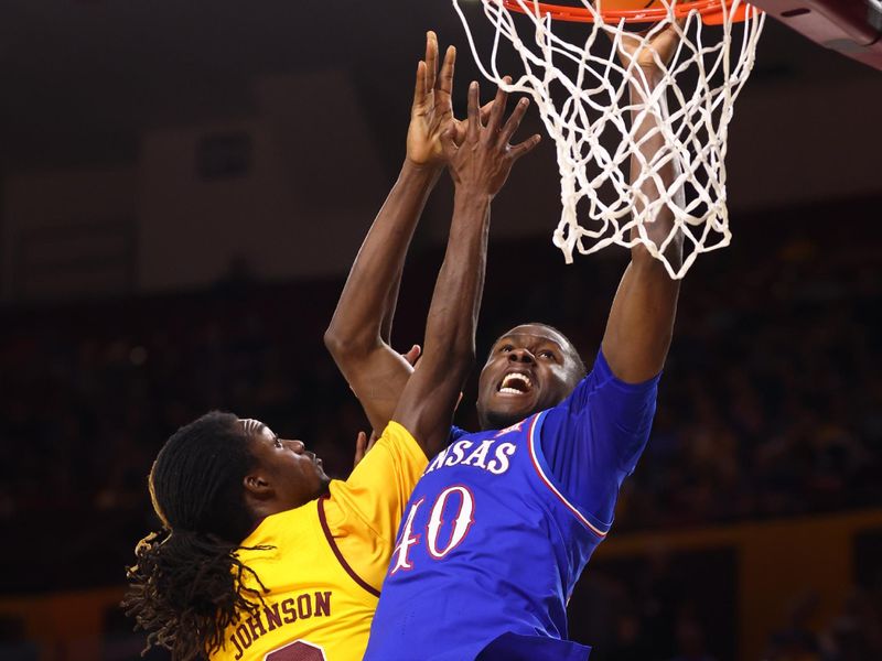 Mar 3, 2026; Tempe, Arizona, USA; Kansas Jayhawks  forward Flory Bidunga (40) against Arizona State Sun Devils guard Anthony Johnson (2) in the second half at Desert Financial Arena. Mandatory Credit: Mark J. Rebilas-Imagn Images
