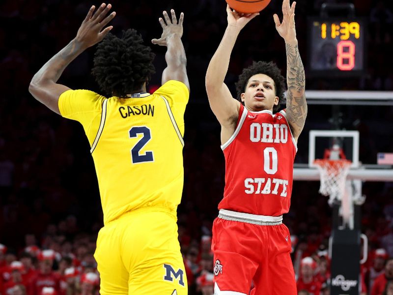 Feb 8, 2026; Columbus, Ohio, USA;  Ohio State Buckeyes guard John Mobley Jr. (0) shoots the ball as Michigan Wolverines guard LJ Cason (2) defends during the second half at Value City Arena. Mandatory Credit: Joseph Maiorana-Imagn Images