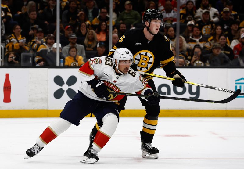 Oct 21, 2025; Boston, Massachusetts, USA; Florida Panthers left wing Brad Marchand (63) cuts in front of Boston Bruins defenseman Mason Lohrei (6)during the first period at TD Garden. Mandatory Credit: Winslow Townson-Imagn Images