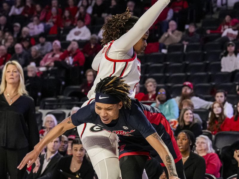 Jan 21, 2024; Athens, Georgia, USA; Ole Miss Rebels forward Snudda Collins (5) collides with Georgia Bulldogs forward Fatima Diakhate (21) while dribbling at Stegeman Coliseum. Mandatory Credit: Dale Zanine-USA TODAY Sports