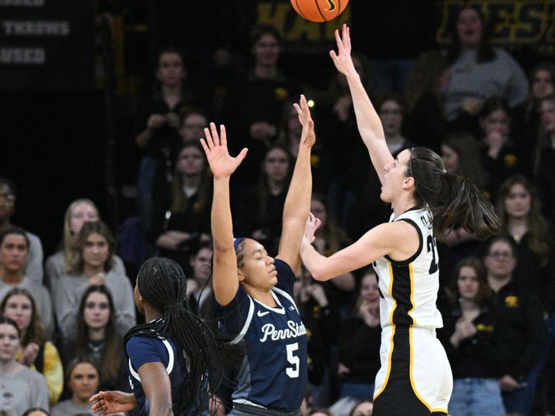 Feb 8, 2024; Iowa City, Iowa, USA; Iowa Hawkeyes guard Caitlin Clark (22) shoots the ball over Penn State Nittany Lions guard Leilani Kapinus (5) and guard Jayla Oden (12) during the first half at Carver-Hawkeye Arena. Mandatory Credit: Jeffrey Becker-USA TODAY Sports