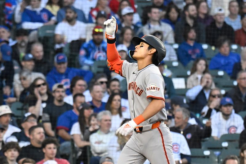 May 6, 2025; Chicago, Illinois, USA;  San Francisco Giants outfielder Jung Hoo Lee (51) points after hitting a two run home run against the Chicago Cubs during the third inning at Wrigley Field. Mandatory Credit: Matt Marton-Imagn Images