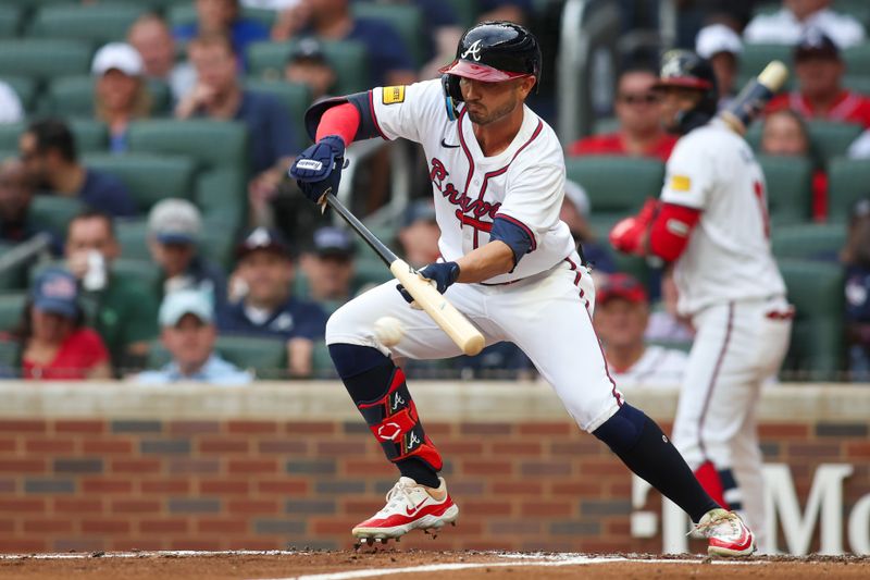 Jun 18, 2024; Atlanta, Georgia, USA; Atlanta Braves right fielder Forrest Wall (37) bunts for a base hit against the Detroit Tigers in the second inning at Truist Park. Mandatory Credit: Brett Davis-USA TODAY Sports
