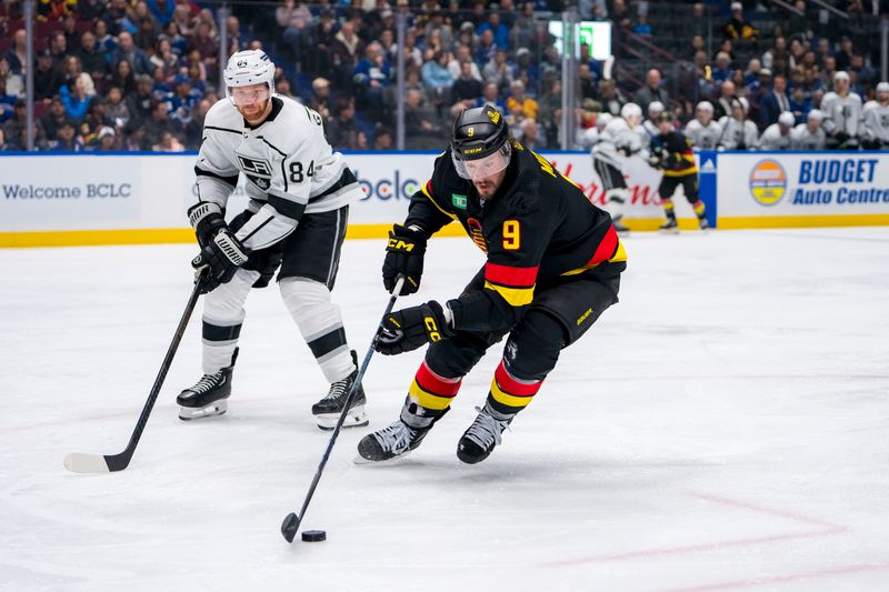 Mar 25, 2024; Vancouver, British Columbia, CAN; Los Angeles Kings defenseman Vladislav Gavrikov (84) watches Vancouver Canucks forward J.T. Miller (9) handle the puck in the third period at Rogers Arena. Kings won 3 -2. Mandatory Credit: Bob Frid-USA TODAY Sports