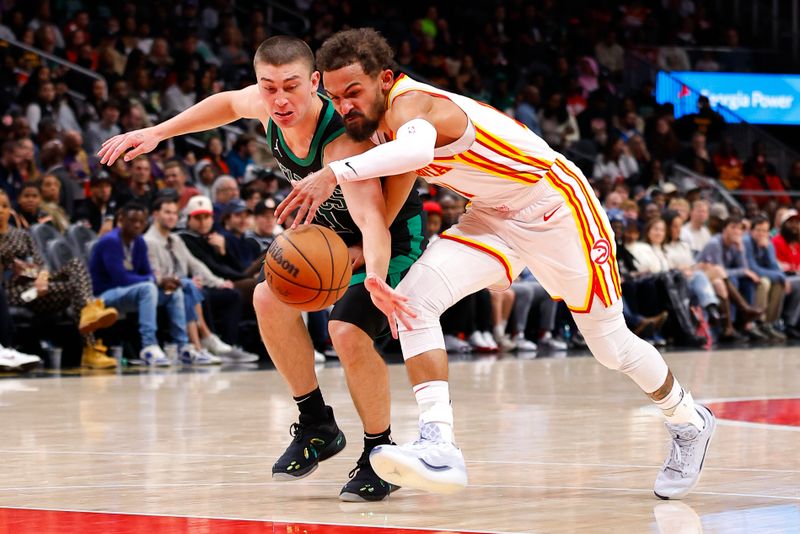 ATLANTA, GEORGIA - NOVEMBER 4: Trae Young #11 of the Atlanta Hawks battles against Payton Pritchard #11 of the Boston Celtics during the third quarter at State Farm Arena on November 4, 2024 in Atlanta, Georgia. NOTE TO USER: User expressly acknowledges and agrees that, by downloading and or using this photograph, User is consenting to the terms and conditions of the Getty Images License Agreement. (Photo by Todd Kirkland/Getty Images)