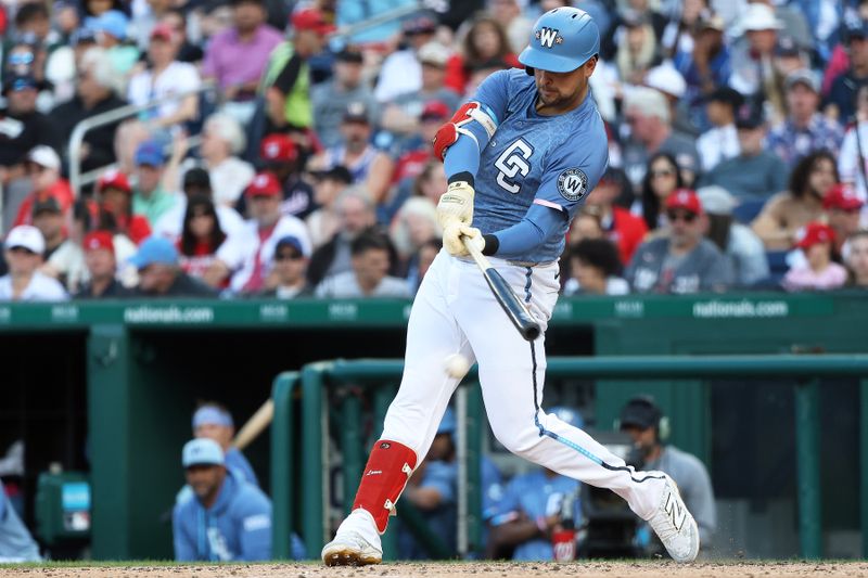 May 24, 2025; Washington, District of Columbia, USA; Washington Nationals first baseman Nathaniel Lowe (33) hits a single during the eighth inning against the San Francisco Giants at Nationals Park. Mandatory Credit: Daniel Kucin Jr.-Imagn Images