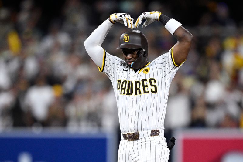 Jul 6, 2024; San Diego, California, USA; San Diego Padres left fielder Jurickson Profar (10) celebrates after hitting an RBI double against the Arizona Diamondbacks during the seventh inning at Petco Park. Mandatory Credit: Orlando Ramirez-USA TODAY Sports