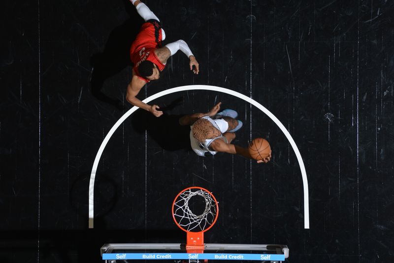 SAN ANTONIO, TX - OCTOBER 26: Jeremy Sochan #10 of the San Antonio Spurs drives to the basket during the game against the Houston Rockets on October 26, 2024 at the Frost Bank Center in San Antonio, Texas. NOTE TO USER: User expressly acknowledges and agrees that, by downloading and or using this photograph, user is consenting to the terms and conditions of the Getty Images License Agreement. Mandatory Copyright Notice: Copyright 2024 NBAE (Photos by Michael Gonzales/NBAE via Getty Images)