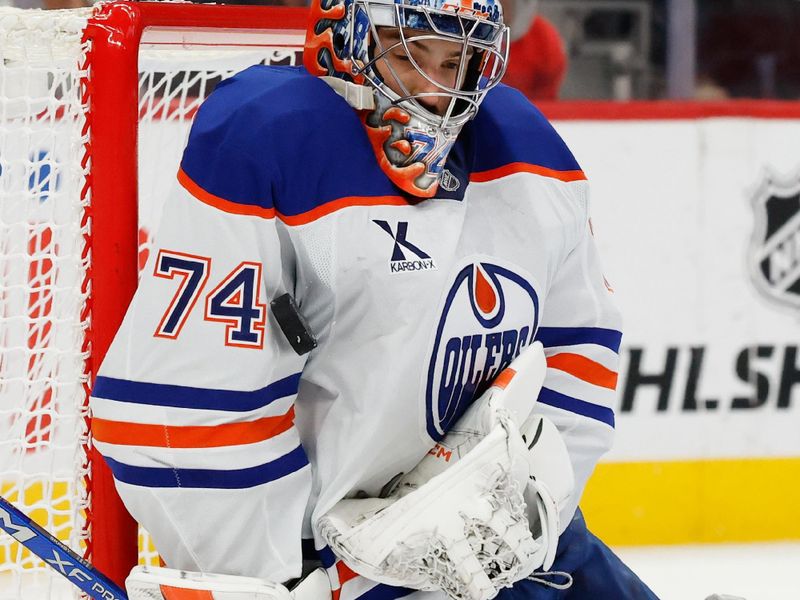 Oct 19, 2025; Detroit, Michigan, USA;  Edmonton Oilers goaltender Stuart Skinner (74) makes a save against the Detroit Red Wings during the second period at Little Caesars Arena. Mandatory Credit: Rick Osentoski-Imagn Images