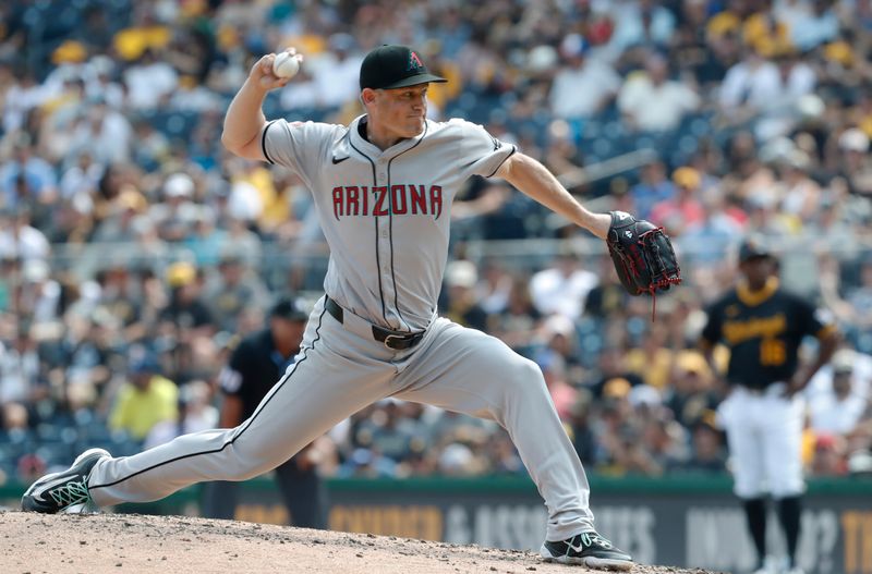 Aug 4, 2024; Pittsburgh, Pennsylvania, USA;  Arizona Diamondbacks relief pitcher Paul Sewald (38) pitches against  the Pittsburgh Pirates during the sixth inning at PNC Park. Mandatory Credit: Charles LeClaire-USA TODAY Sports