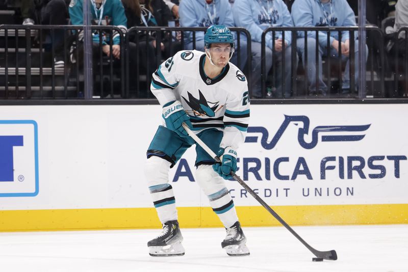 Oct 28, 2024; Salt Lake City, Utah, USA;  San Jose Sharks center Alexander Wennberg (21) controls the puck during the third period against the Utah Hockey Club at Delta Center. Mandatory Credit: Chris Nicoll-Imagn Images