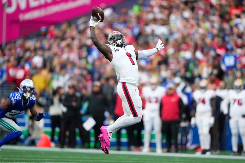 San Francisco 49ers wide receiver Deebo Samuel Sr. (1) makes a catch against the Seattle Seahawks during the first half of an NFL football game, Thursday, Oct. 10, 2024, in Seattle. (AP Photo/Lindsey Wasson)