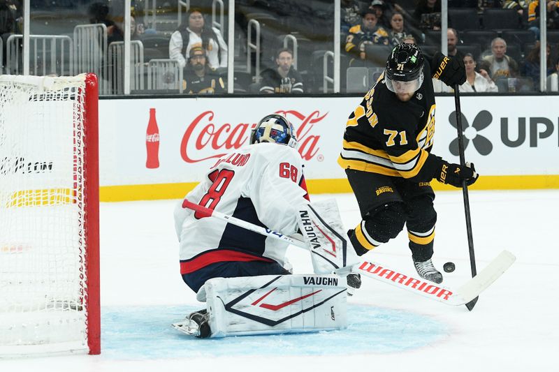 Sep 21, 2025; Boston, Massachusetts, USA; Washington Capitals goaltender Garin Bjorklund (68) makes a save on Boston Bruins left wing Viktor Arvidsson (71) during the third period at TD Garden. Mandatory Credit: Bob DeChiara-Imagn Images