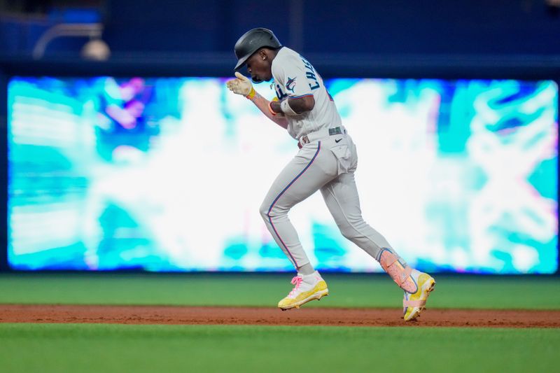 Sep 17, 2023; Miami, Florida, USA; Miami Marlins center fielder Jazz Chisholm Jr. (2) celebrates after hitting a grand slam against the Atlanta Braves during the third inning at loanDepot Park. Mandatory Credit: Rich Storry-USA TODAY Sports