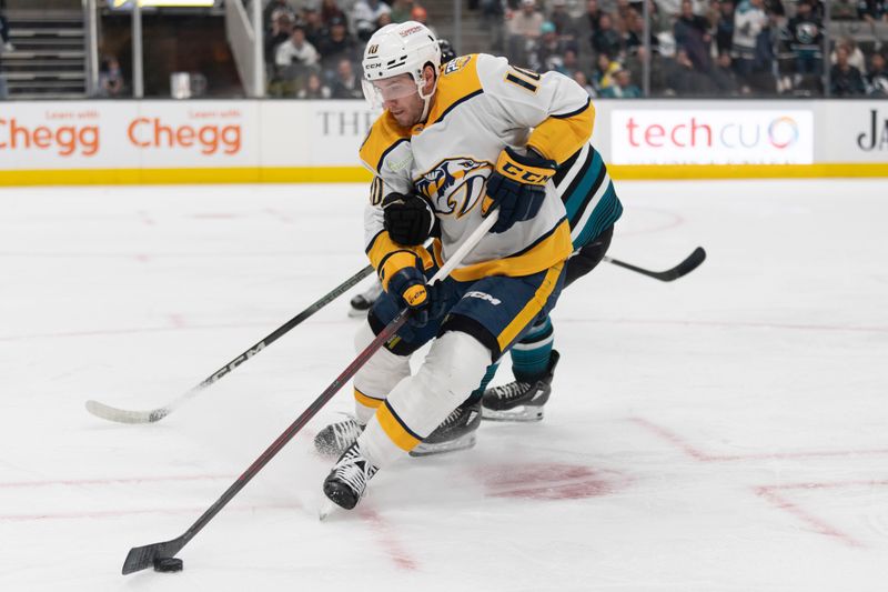 Feb 24, 2024; San Jose, California, USA; Nashville Predators center Colton Sissons (10) controls the puck during the first period against the San Jose Sharks at SAP Center at San Jose. Mandatory Credit: Stan Szeto-USA TODAY Sports