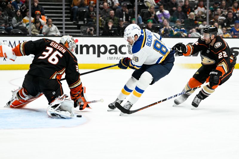 Mar 25, 2023; Anaheim, California, USA; Anaheim Ducks goalie John Gibson (36) blocks a shot by St. Louis Blues left wing Pavel Buchnevich (89) during the second period at Honda Center. Mandatory Credit: Kelvin Kuo-USA TODAY Sports