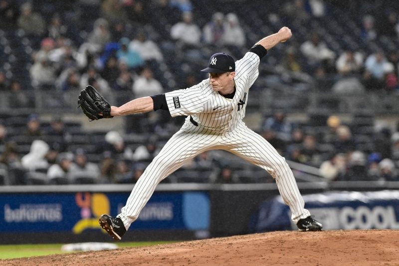May 21, 2025; Bronx, New York, USA; New York Yankees pitcher Tim Hill (41) pitches against the Texas Rangers during the sixth inning at Yankee Stadium. Mandatory Credit: John Jones-Imagn Images
