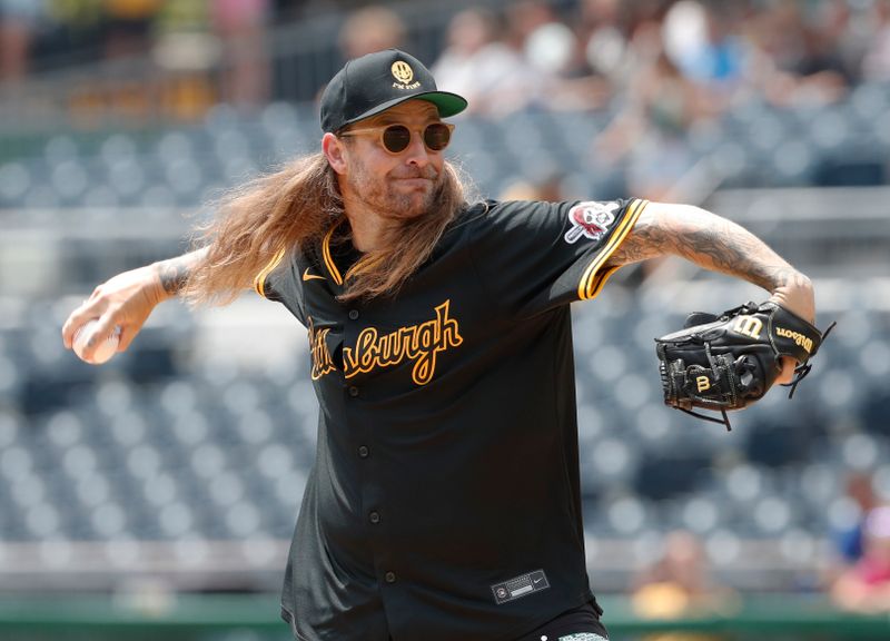 Jul 8, 2024; Pittsburgh, Pennsylvania, USA;  Recording artist Joey Bradford of the band The Used throws out a ceremonial first pitch before the Pittsburgh Pirates host the New York Mets at PNC Park. Mandatory Credit: Charles LeClaire-USA TODAY Sports