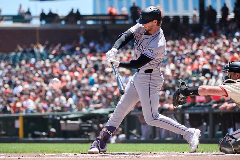 May 19, 2024; San Francisco, California, USA; Colorado Rockies infielder Ryan McMahon (24) hits a one run home run against the San Francisco Giants during the first inning at Oracle Park. Mandatory Credit: Robert Edwards-USA TODAY Sports