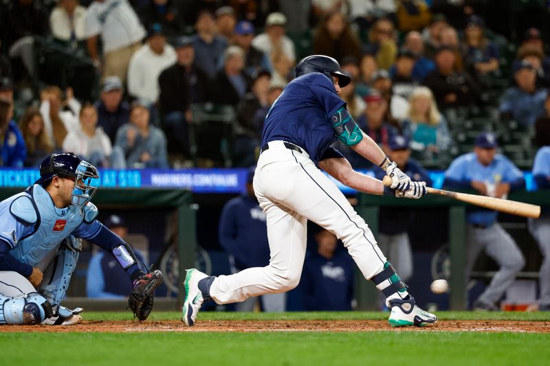 Aug 27, 2024; Seattle, Washington, USA; Seattle Mariners left fielder Luke Raley (20) strikes out against the Tampa Bay Rays to end the ninth inning against the Tampa Bay Rays at T-Mobile Park. Mandatory Credit: Joe Nicholson-USA TODAY Sports