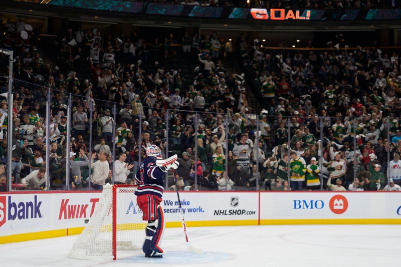 Oct 28, 2025; Saint Paul, Minnesota, USA; Winnipeg Jets goaltender Connor Hellebuyck (37) watches as a delayed goal is called scored by Minnesota Wild left wing Kirill Kaprizov (97) in the second period at Grand Casino Arena. Mandatory Credit: Matt Blewett-Imagn Images