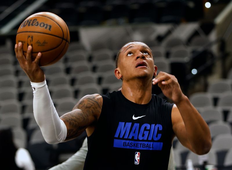 SAN ANTONIO, TX - MARCH 14: Paolo Banchero #5 of the Orlando Magic goes through warm-up drills before the start of their game against the San Antonio Spurs at AT&T Center on March 14, 2023 in San Antonio, Texas. NOTE TO USER: User expressly acknowledges and agrees that, by downloading and or using this photograph, User is consenting to terms and conditions of the Getty Images License Agreement. (Photo by Ronald Cortes/Getty Images)