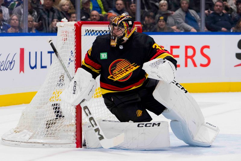 Dec 23, 2023; Vancouver, British Columbia, CAN; Vancouver Canucks goalie Thatcher Demko (35) watches the rebound against the San Jose Sharks in the second period at Rogers Arena. Mandatory Credit: Bob Frid-USA TODAY Sports