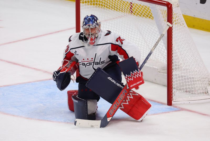 Nov 1, 2025; Buffalo, New York, USA;  Washington Capitals goaltender Charlie Lindgren (79) looks for the puck during the third period against the Buffalo Sabres at KeyBank Center. Mandatory Credit: Timothy T. Ludwig-Imagn Images