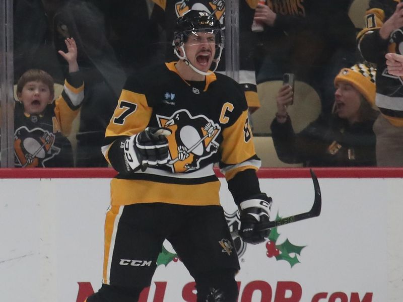 Nov 23, 2024; Pittsburgh, Pennsylvania, USA;  Pittsburgh Penguins center Sidney Crosby (87) reacts after scoring his 600th career NHL goal against the Utah Hockey Club during the second period at PPG Paints Arena. Mandatory Credit: Charles LeClaire-Imagn Images