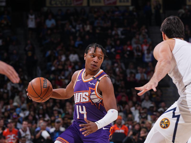 DENVER, CO - OCTOBER 13: TyTy Washington Jr. #14 of the Phoenix Suns dribbles the ball during the game against the Denver Nuggets on October 13, 2024 at Ball Arena in Denver, Colorado. NOTE TO USER: User expressly acknowledges and agrees that, by downloading and/or using this Photograph, user is consenting to the terms and conditions of the Getty Images License Agreement. Mandatory Copyright Notice: Copyright 2024 NBAE (Photo by Bart Young/NBAE via Getty Images)