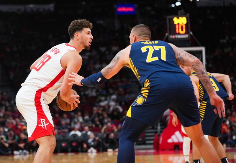 HOUSTON, TEXAS - OCTOBER 10: Alperen Sengun #28 of the Houston Rockets holds the ball during the preseason game against the Indiana Pacers at Toyota Center on October 10, 2023 in Houston, Texas. NOTE TO USER: User expressly acknowledges and agrees that, by downloading and or using this photograph, User is consenting to the terms and conditions of the Getty Images License Agreement. (Photo by Alex Bierens de Haan/Getty Images)