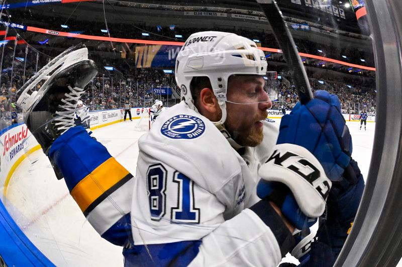 Nov 5, 2024; St. Louis, Missouri, USA;  Tampa Bay Lightning defenseman Erik Cernak (81) checks St. Louis Blues defenseman Pierre-Olivier Joseph (77) during the second period at Enterprise Center. Mandatory Credit: Jeff Curry-Imagn Images