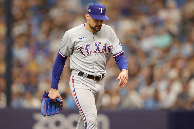 Oct 4, 2023; St. Petersburg, Florida, USA; Texas Rangers starting pitcher Nathan Eovaldi (17) leaves the mound after the fifth inning against the Tampa Bay Rays during game two of the Wildcard series for the 2023 MLB playoffs at Tropicana Field. Mandatory Credit: Nathan Ray Seebeck-USA TODAY Sports