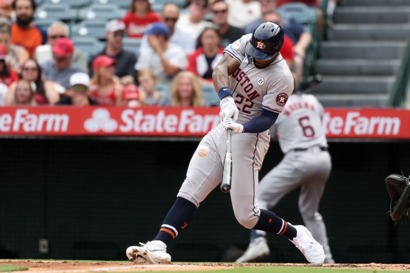 Sep 15, 2024; Anaheim, California, USA; Houston Astros left fielder Jason Heyward (22) hits a home run during the third inning against the Los Angeles Angels at Angel Stadium. Mandatory Credit: Kiyoshi Mio-Imagn Images