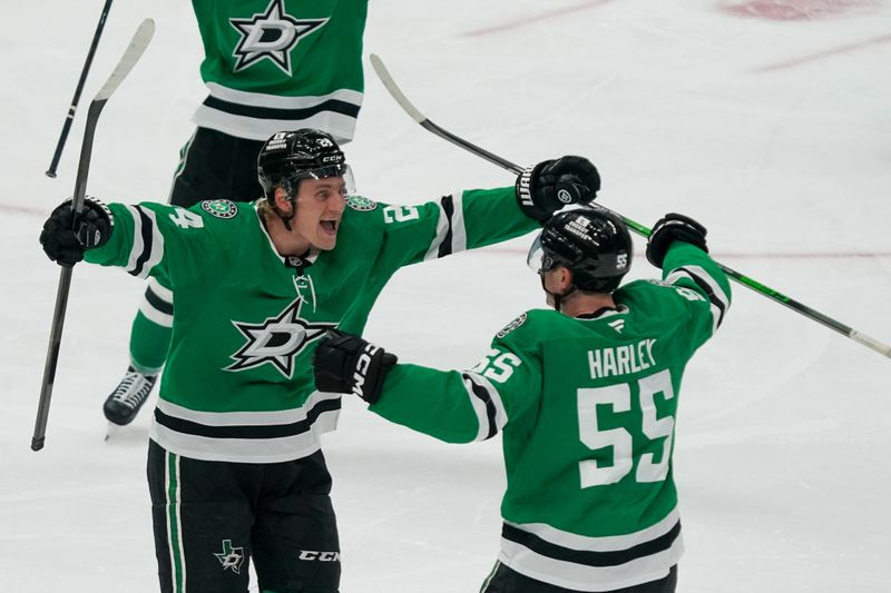 Apr 19, 2025; Dallas, Texas, USA; Dallas Stars center Roope Hintz (24) celebrates his goal with defenseman Thomas Harley (55) during the third period in game one of the first round of the 2025 Stanley Cup Playoffs against the Colorado Avalanche at American Airlines Center. Mandatory Credit: Raymond Carlin III-Imagn Images
