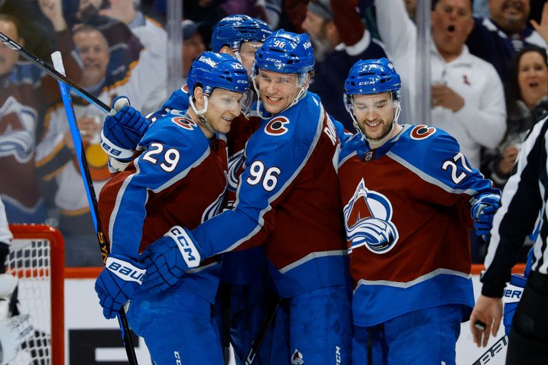 Mar 22, 2024; Denver, Colorado, USA; Colorado Avalanche right wing Mikko Rantanen (96) celebrates his goal with center Nathan MacKinnon (29) and left wing Jonathan Drouin (27) and right wing Valeri Nichushkin (13) in the third period against the Columbus Blue Jackets at Ball Arena. Mandatory Credit: Isaiah J. Downing-USA TODAY Sports