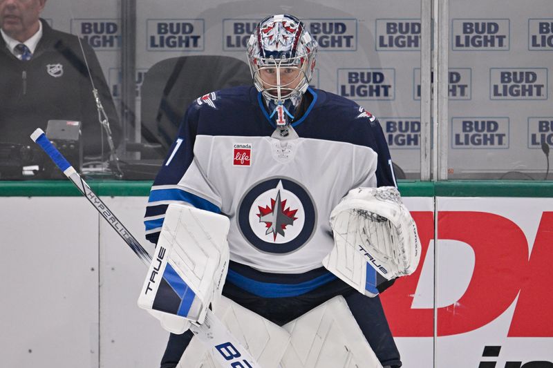 May 13, 2025; Dallas, Texas, USA; Winnipeg Jets goaltender Eric Comrie (1) skates in warmups prior to the start of the game against the Dallas Stars in game four of the second round of the 2025 Stanley Cup Playoffs at American Airlines Center. Mandatory Credit: Jerome Miron-Imagn Images