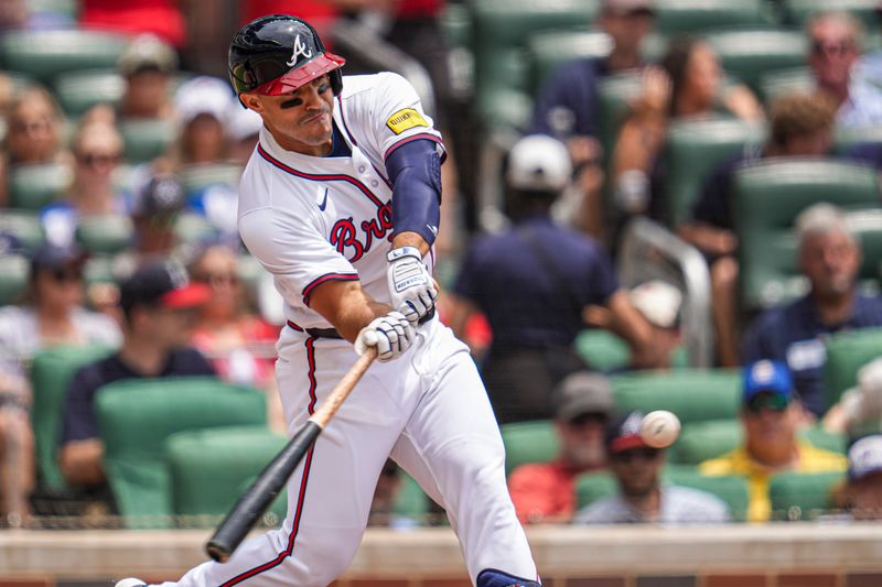 Jun 19, 2024; Cumberland, Georgia, USA; Atlanta Braves right fielder Ramon Laureano (18) hits a single against the Detroit Tigers during the second inning at Truist Park. Mandatory Credit: Dale Zanine-USA TODAY Sports