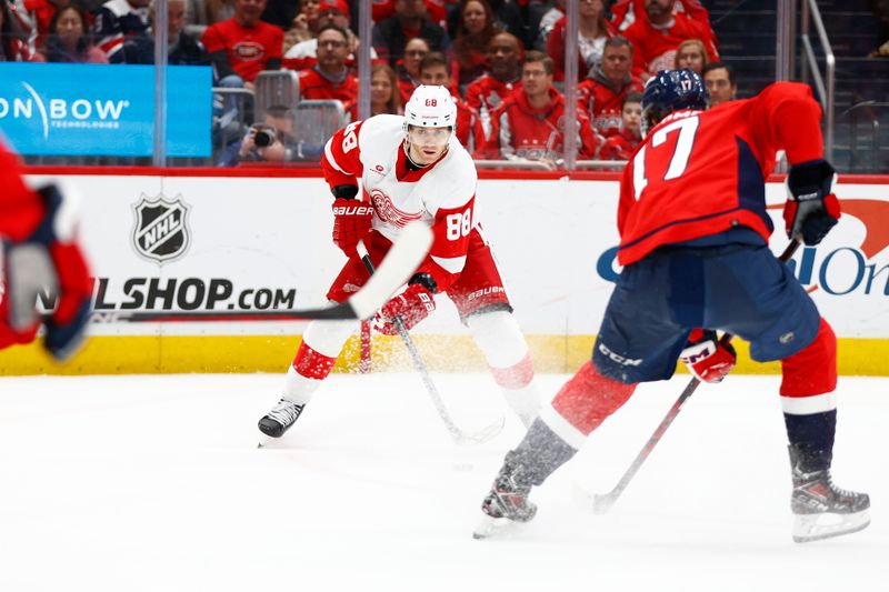 Mar 26, 2024; Washington, District of Columbia, USA; Detroit Red Wings right wing Patrick Kane (88) controls the puck as Washington Capitals center Dylan Strome (17) defends during the second period at Capital One Arena. Mandatory Credit: Amber Searls-USA TODAY Sports