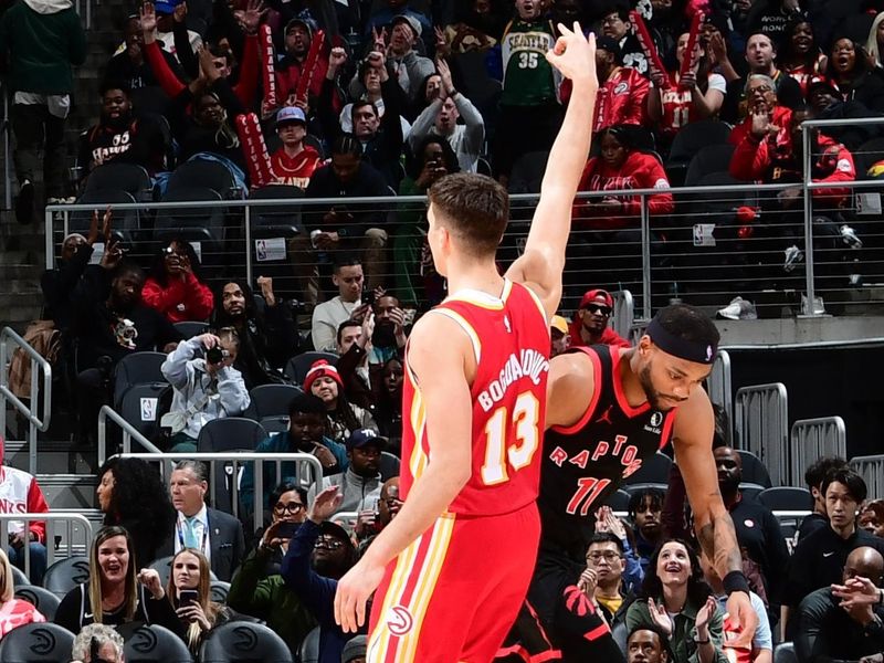 ATLANTA, GA - JANUARY 28: Bogdan Bogdanovic #13 of the Atlanta Hawks celebrates a three point basket during the game against the Toronto Raptors on January 28, 2024 at State Farm Arena in Atlanta, Georgia.  NOTE TO USER: User expressly acknowledges and agrees that, by downloading and/or using this Photograph, user is consenting to the terms and conditions of the Getty Images License Agreement. Mandatory Copyright Notice: Copyright 2024 NBAE (Photo by Scott Cunningham/NBAE via Getty Images)