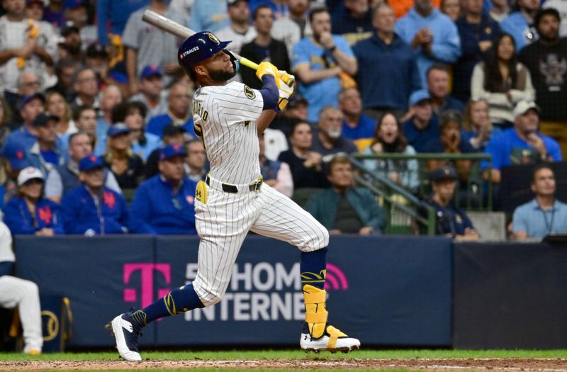 Oct 2, 2024; Milwaukee, Wisconsin, USA; Milwaukee Brewers outfielder Jackson Chourio (11) hits a home run during the eighth inning in game two of the Wildcard round for the 2024 MLB Playoffs against the New York Mets at American Family Field. Mandatory Credit: Benny Sieu-Imagn Images