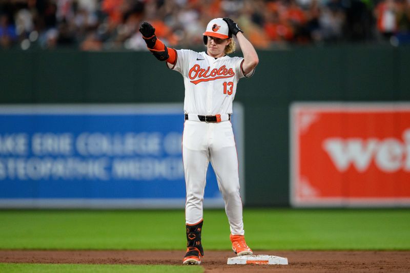 Jun 30, 2024; Baltimore, Maryland, USA; Baltimore Orioles outfielder Heston Kjerstad (13) reacts after hitting a double during the fourth inning against the Texas Rangers at Oriole Park at Camden Yards. Mandatory Credit: Reggie Hildred-USA TODAY Sports