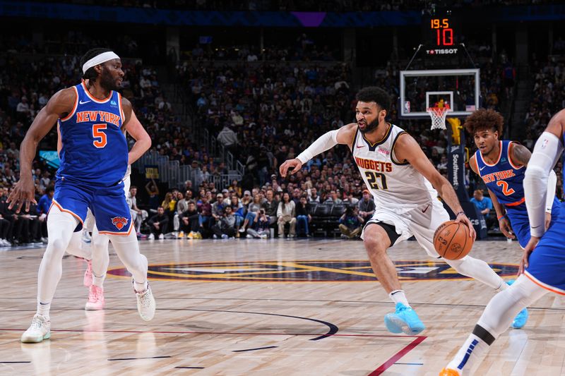 DENVER, CO - MARCH 21: Jamal Murray #27 of the Denver Nuggets handles the ball during the game against the New York Knicks on March 21, 2024 at the Ball Arena in Denver, Colorado. NOTE TO USER: User expressly acknowledges and agrees that, by downloading and/or using this Photograph, user is consenting to the terms and conditions of the Getty Images License Agreement. Mandatory Copyright Notice: Copyright 2024 NBAE (Photo by Garrett Ellwood/NBAE via Getty Images)