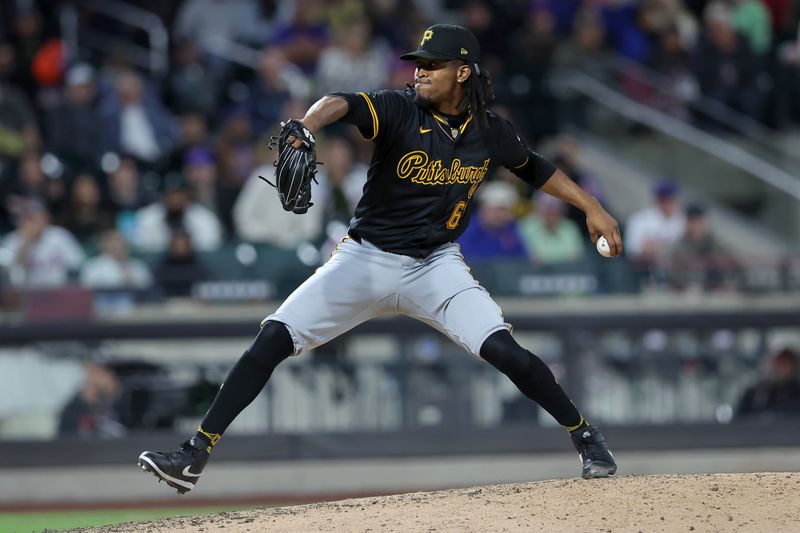 Apr 16, 2024; New York City, New York, USA; Pittsburgh Pirates pitcher Jose Hernandez (61) pitches against the New York Mets during the seventh inning at Citi Field. Mandatory Credit: Brad Penner-USA TODAY Sports