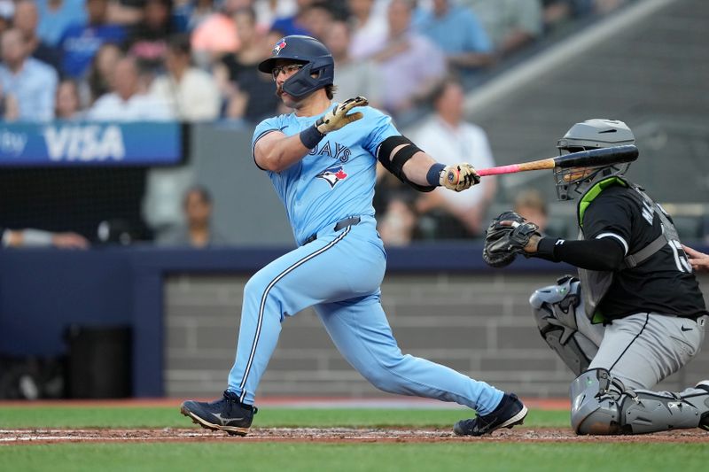 May 22, 2024; Toronto, Ontario, CAN; Toronto Blue Jays left fielder Davis Schneider (36) hits a two run single against the Chicago White Sox during the second inning at Rogers Centre. Mandatory Credit: John E. Sokolowski-USA TODAY Sports