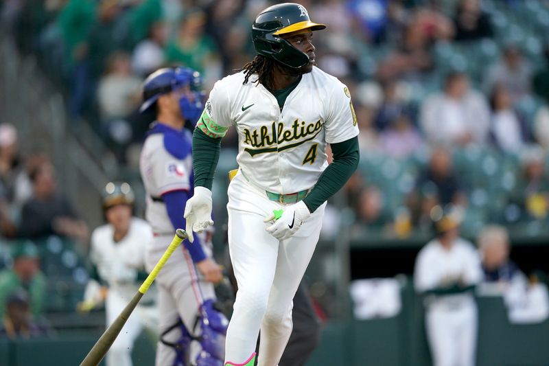 Apr 23, 2025; West Sacramento, California, USA; Athletics right fielder Lawrence Butler (4) reacts after hitting a home run against the Texas Rangers in the first inning at Sutter Health Park. Mandatory Credit: Cary Edmondson-Imagn Images