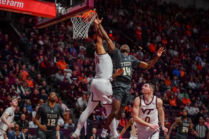 Jan 27, 2024; Blacksburg, Virginia, USA; Virginia Tech Hokies forward Mylyjael Poteat (34) blocks Georgia Tech Yellow Jackets guard Kowacie Reeves Jr. (14) during the first half at Cassell Coliseum. Mandatory Credit: Brian Bishop-USA TODAY Sports