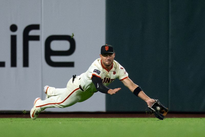 Aug 14, 2024; San Francisco, California, USA; San Francisco Giants left fielder Michael Conforto (8) attempts to make a catch during the ninth inning at Oracle Park. Mandatory Credit: D. Ross Cameron-USA TODAY Sports