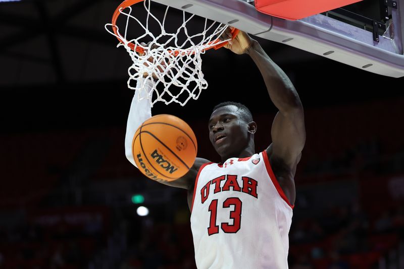 Dec 5, 2023; Salt Lake City, Utah, USA; Utah Utes center Keba Keita (13) dunks the ball against the Southern Utah Thunderbirds during the second half at Jon M. Huntsman Center. Mandatory Credit: Rob Gray-USA TODAY Sports